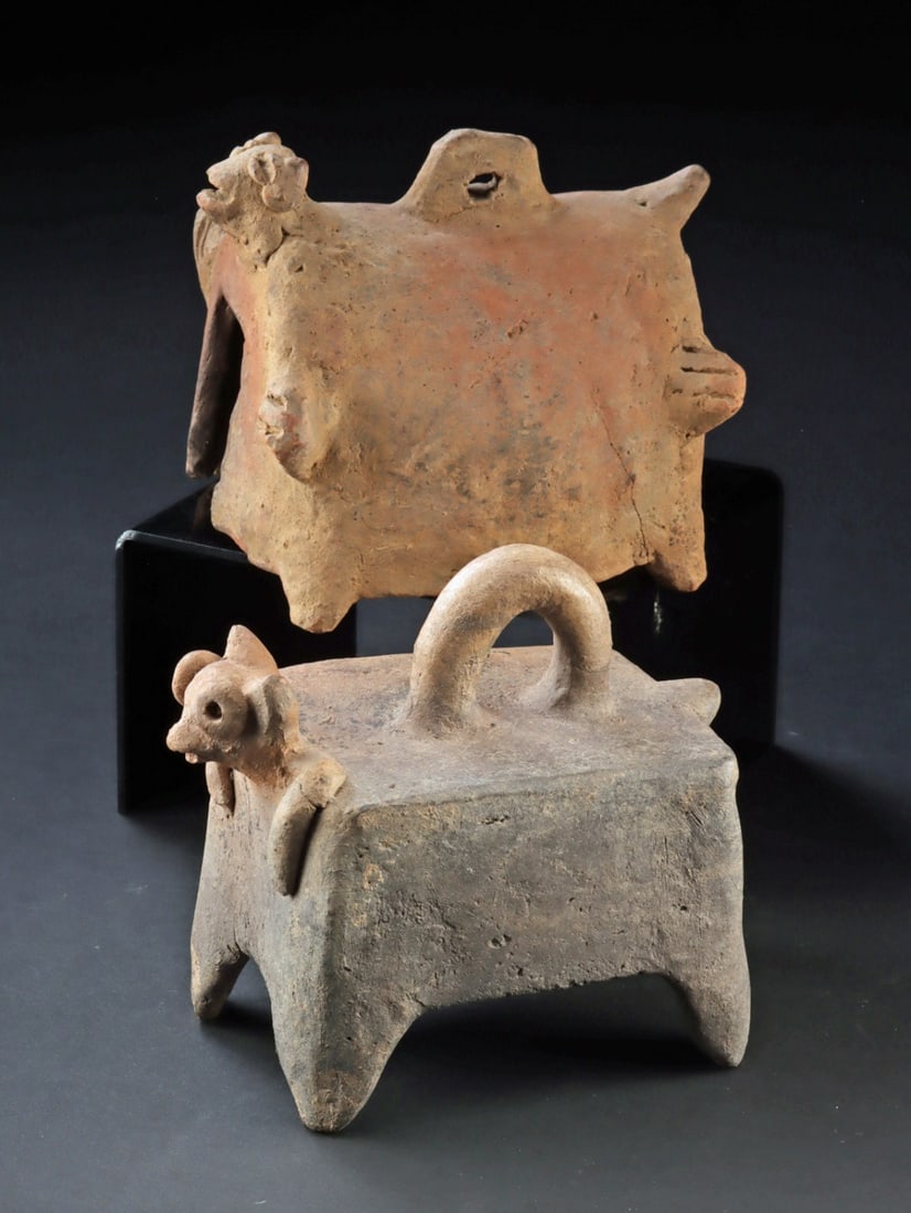 Colima Pottery Censer Lids House-Form Covers, Animal Protomes: Pre-Columbian, Mesoamerica, West México, Colima, Shaft Tomb tradition. Ca. 100 BCE - 300 CE. A charismatic pair of architectural censer lids modeled as diminutive house-shrines, one a barrel-vaul