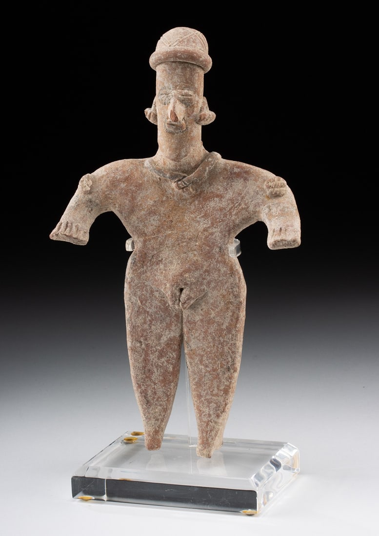 Colima Pottery Standing Figure: Pre-Columbian, West Mexico, Colima, ca. 300 BCE to 300 CE. An impressive pottery figure of a female. The ancient figure stands atop straight legs and narrow feet, displaying a slender waist, broad sho
