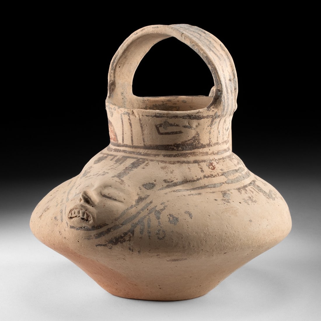 Huastec Polychrome Effigy Pouring Vessel w/ Face: Pre-Columbian, Mexico, Huastec, ca. 900–1200 CE. A buff-slipped earthenware pouring vessel from the Gulf Coast Huastec tradition, its plump carinated body resolving on one side into a modeled hu