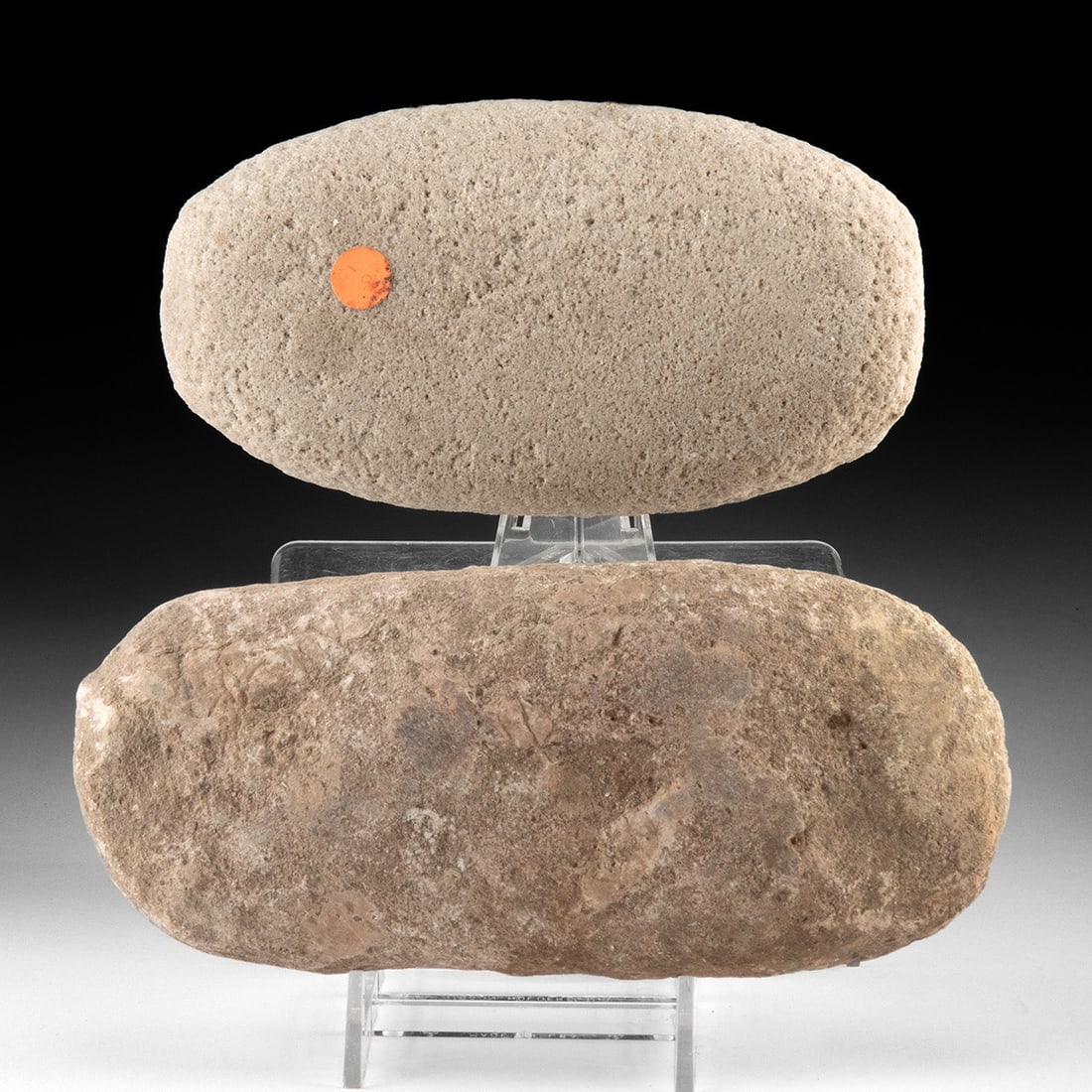 Pair of Southwest Native American Manos Grinding Stones: Native American, Southwestern United States, ca. 1000 BCE – 1900 CE. A pair of hand-held grinding stones, or manos, shaped and smoothed by use into oblong cobbles of dense sandstone. One retains