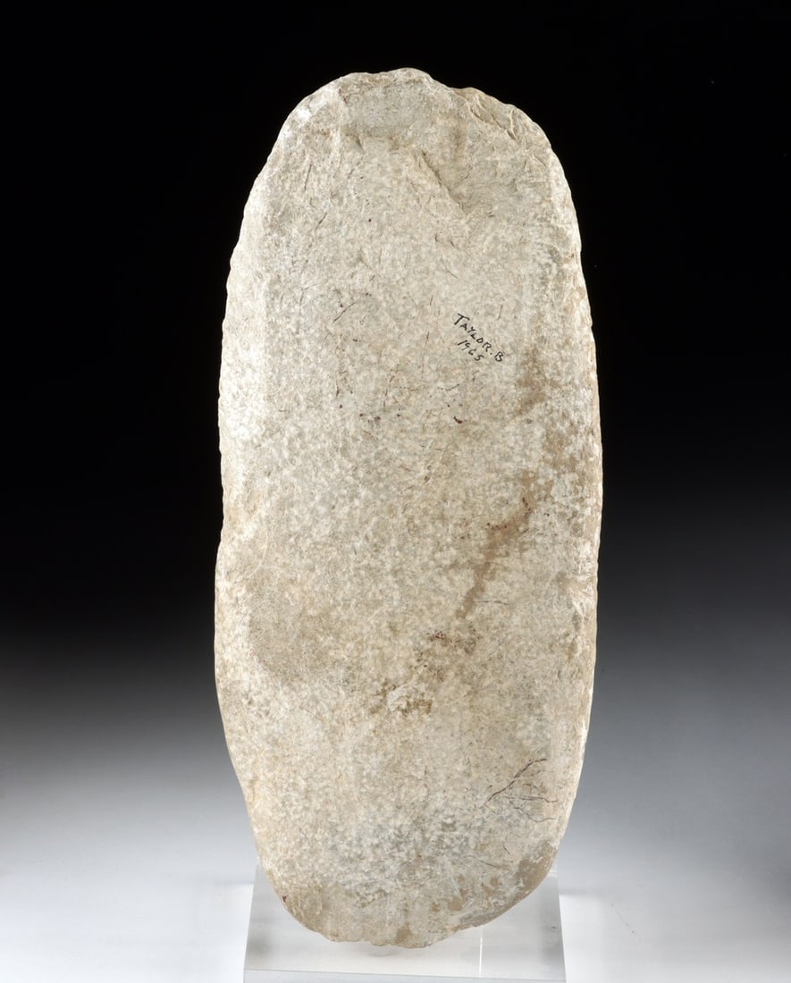 Woodland Period Stone Grinding Slab - Kentucky Cave Find: Native American, Eastern Woodland cultures, ca. 1000 BCE – 1000 CE. A substantial oval grinding stone shaped from dense gray sandstone, its broad face worn smooth by generations of repetitive la