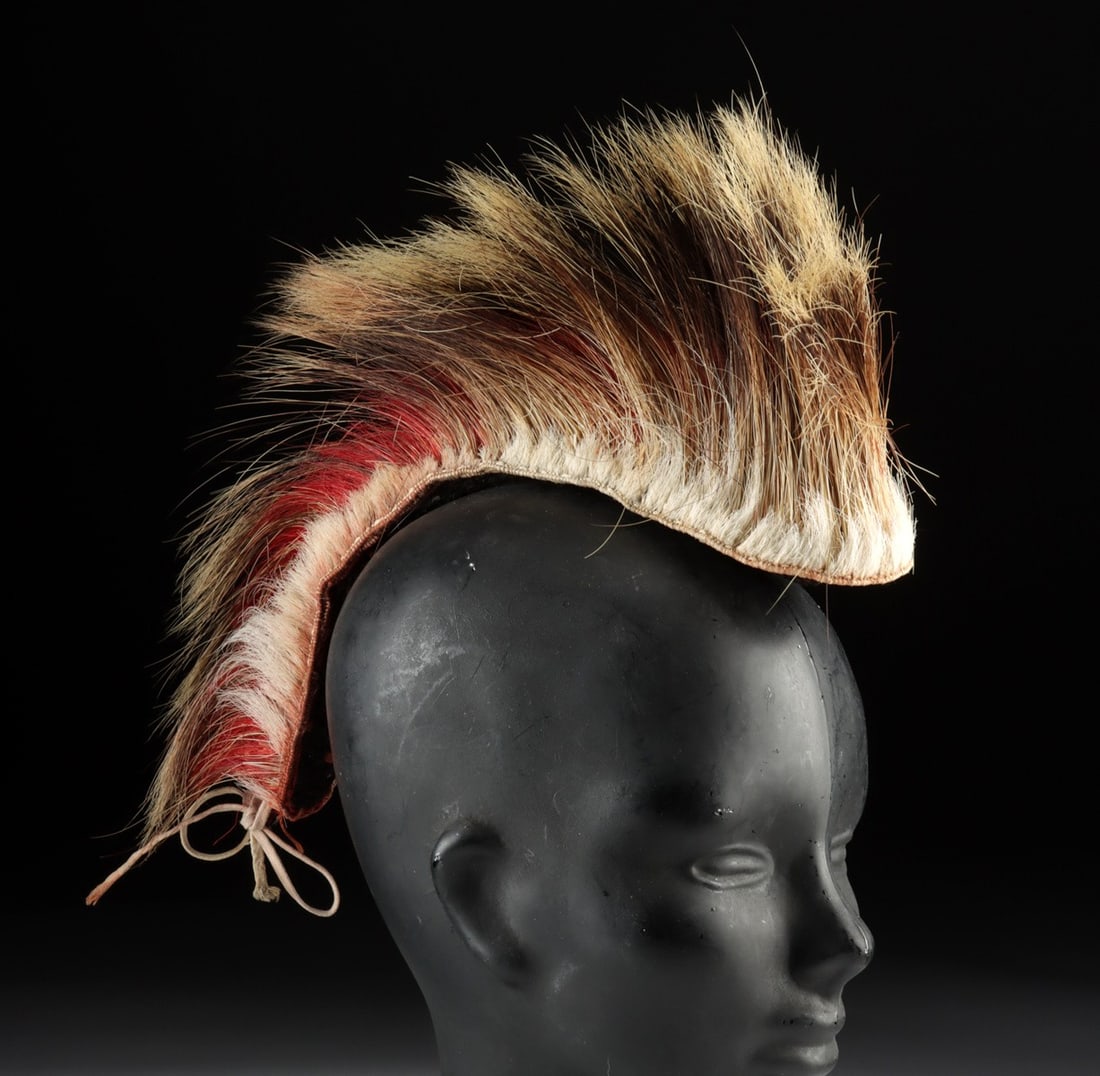 Native American Porcupine & Dyed Deer Hair Roach: Native American, Midwestern to Northeastern United States,, ca. mid-20th century CE. A traditional porcupine hair roach, constructed from a dense field of natural porcupine and red-dyed deer hair. The