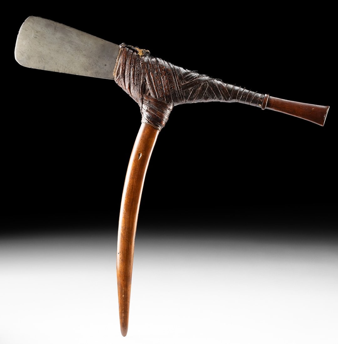 Papua New Guinea Dance Axe - Stone Blade: Oceania, Papua New Guinea, ca. 20th century CE. A finely balanced ceremonial dance axe combining strength, symbolism, and movement, this Papua New Guinea example features a polished stone blade secure