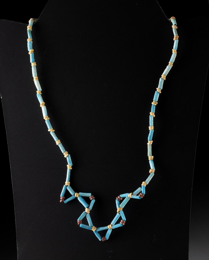 Egyptian Late Dynastic Faience Bead Necklace: Egypt, Late Dynastic Period, ca. 664 to 332 BCE. A luminous necklace composed of dozens of Egyptian faience beads, their pale blue tones recalling the sacred color of the Nile and the open sky. The st
