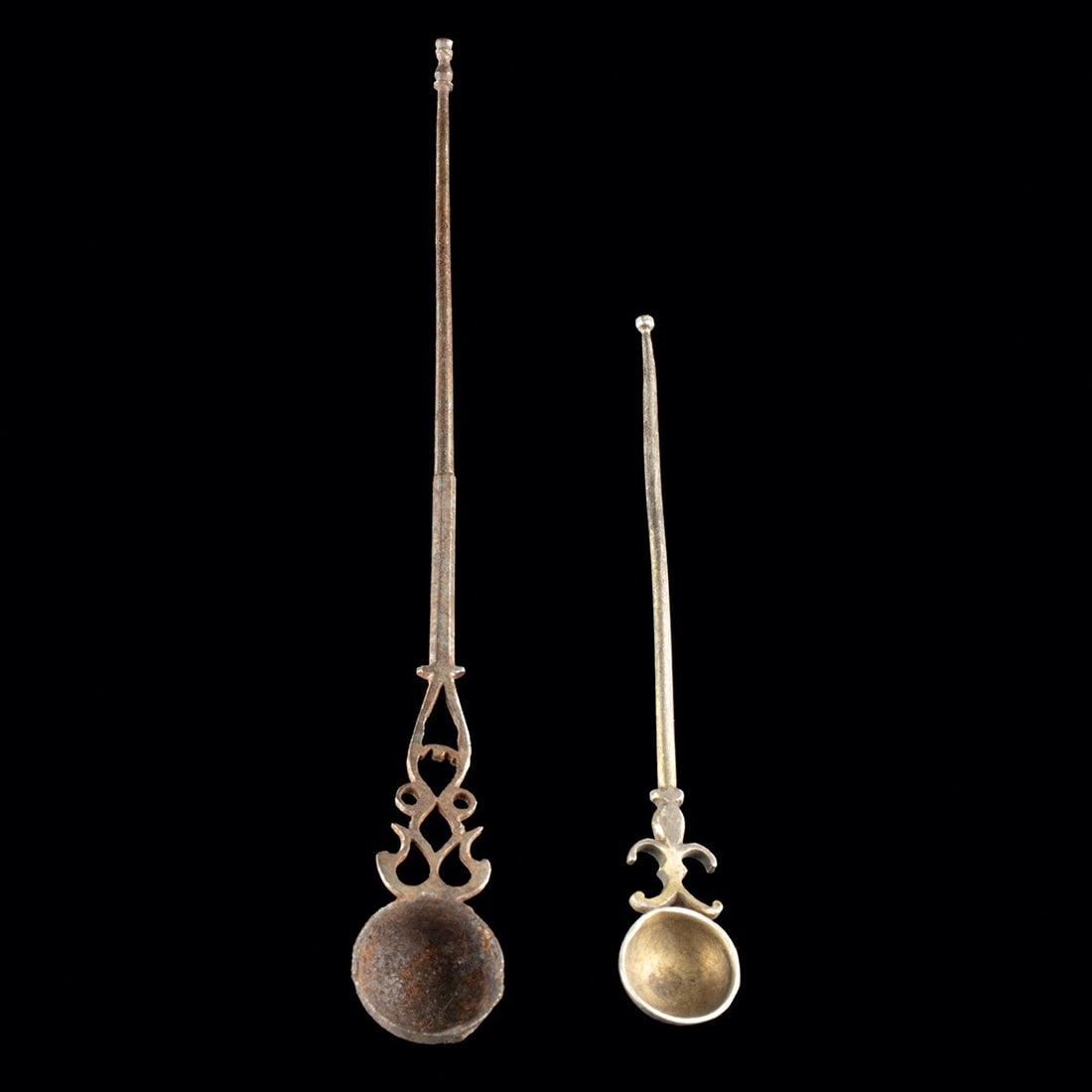 19th C. Islamic Iron / Gilt Silver Ritual Spoons: Near East, Islamic, ca. 1800–1899 CE. Near East, Islamic period, ca. 19th century CE. A pair of slender ritual spoons, each pairing a small hemispherical bowl with a long tapering shaft and open