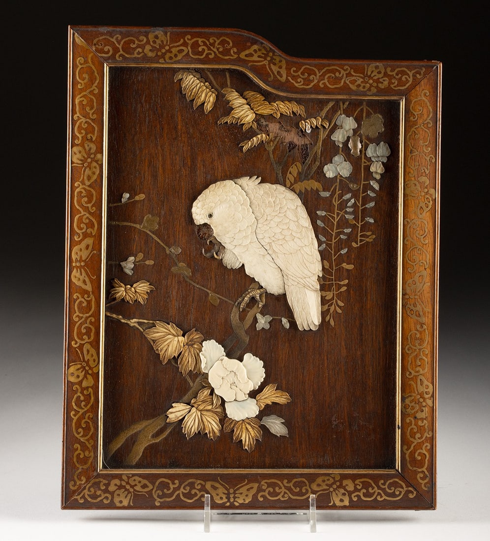 Meiji Inlaid Wood Panel - Cockatoo on Branch: Japan, Meiji period, ca. late 19th to early 20th century CE. A beautifully executed Shibayama-inlaid wood panel depicting a cockatoo perched on a flowering branch, its feathers delicately carved in sh