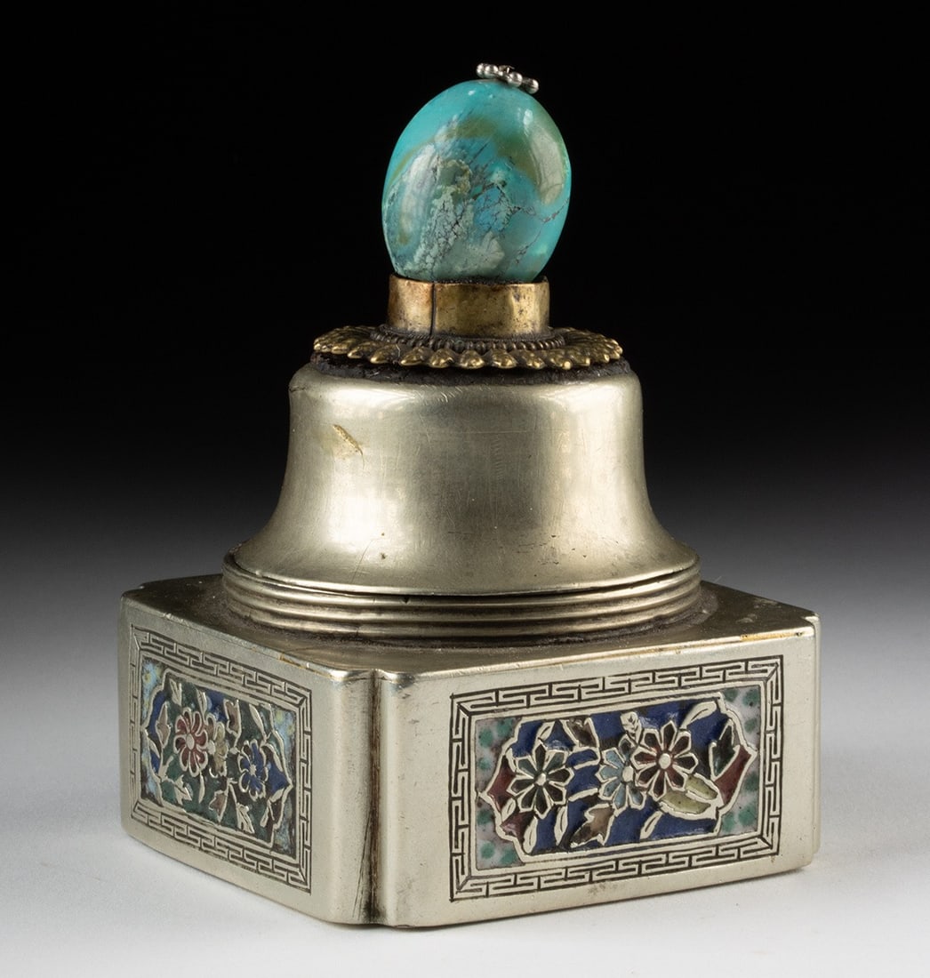 Ornate Chinese Enamel Inlaid Nickel-Brass Inkwell: East Asia, China, ca. mid-20th century CE. A nickel-brass inkwell of square form fitted with colorful enamel inlay panels depicting floral motifs within geometric borders, the vessel topped by a domed