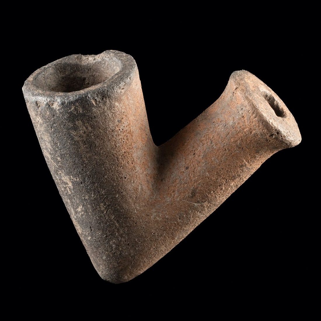 17th C. Spanish Colonial Caribbean Terracotta Pipe Bowl: Spanish Colonial, Caribbean, ca. 1600–1800 CE. A modest yet evocative survivor of the colonial Caribbean, this hand-formed terracotta pipe bowl preserves the angled elbow profile favored by smok