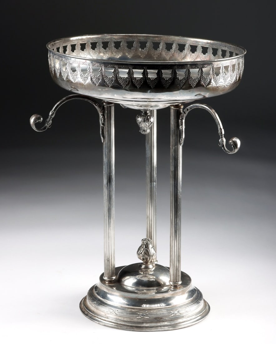 Early 20th C. Silver-Plated Centerpiece Tazza - Neoclassical Columns: Western Europe, Continental, ca. 1900–1925 CE. A footed silver-plated tazza rises on a trio of slender reeded columns, an architecture borrowed from the classical orders and reimagined for the d