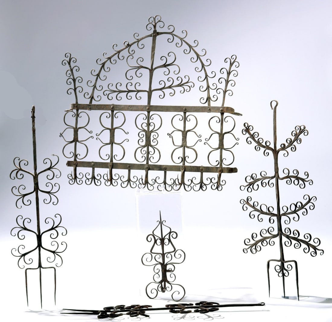 European Iron Archelle Fireplace Rack Set | 5-Hook Rail & Tools: European, acquired in Argentina, ca. 19th to early 20th century CE. An elaborate wrought iron hearth rack, known in French as an archelle, with a wide arched frame and dense curvilinear scrollwork tha