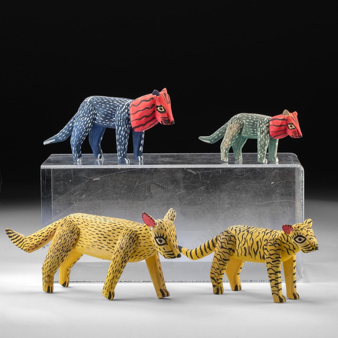 Mexican Wood Alebrijes - Jimenez - Feline Group of Lions, Tigers & Jaguars: North America, Mexico, Oaxaca, ca. mid to late 20th century CE. A group of four hand-carved and hand-painted wooden felines attributable to Manuel Jimenez Ramirez, the celebrated originator of Oaxacan
