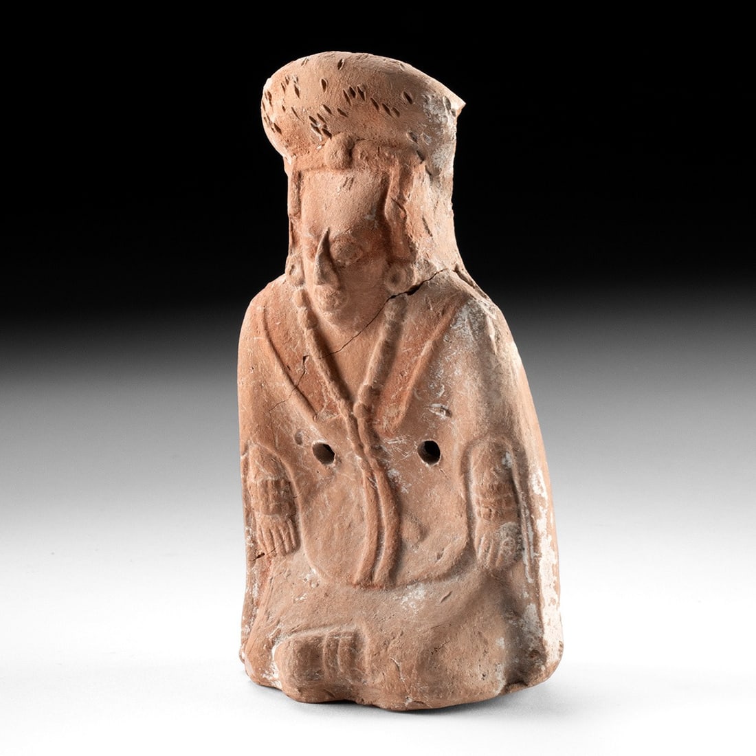 Maya Redware Pottery Figural Rattle - Seated Dignitary: Pre-Columbian, Mexico, Maya, ca. 600–900 CE. A seated dignitary molded in warm reddish earthenware, hands resting composedly upon the knees beneath a broad, flaring headdress that crowns the fig