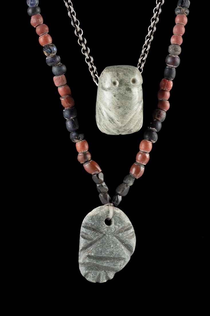 Mezcala Maskette & Costa Rican Jade Frog Pendants: Pre-Columbian, Mesoamerica, Guerrero, Mezcala culture, ca. 300 BCE to 100 CE; Central America, Costa Rica, ca. 500 to 1000 CE. This wearable pair comprises a Guerrero Mezcala blackstone maskette penda