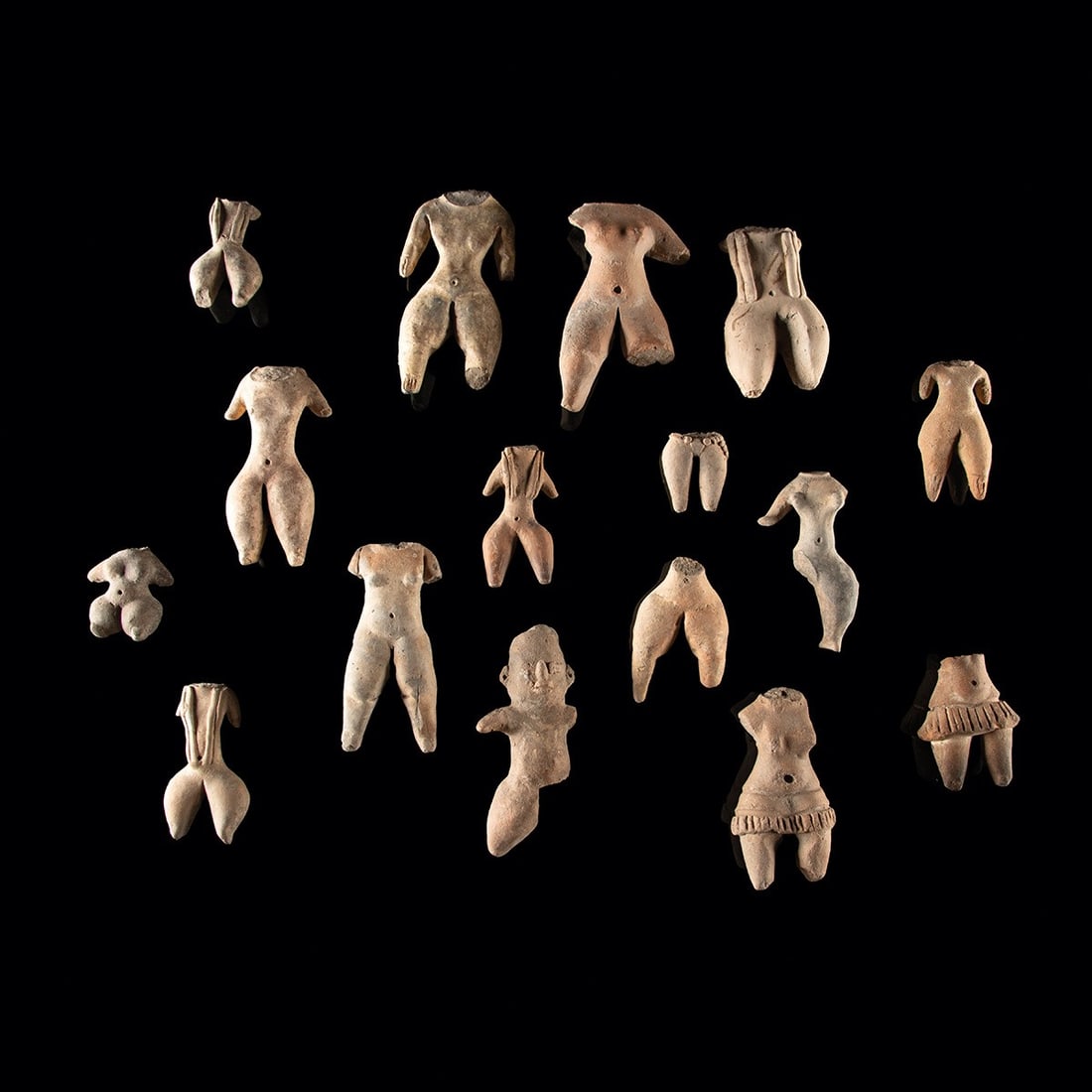 Pre-Columbian Chupicuaro & Tlatilco Style Pottery Torsos: Pre-Columbian, Mexico, Chupicuaro & Tlatilco, ca. 500 BCE – 300 CE. A group of sixteen Pre-Columbian pottery figure torsos from West and Central Mexico, likely Chupicuaro and related Preclassic 