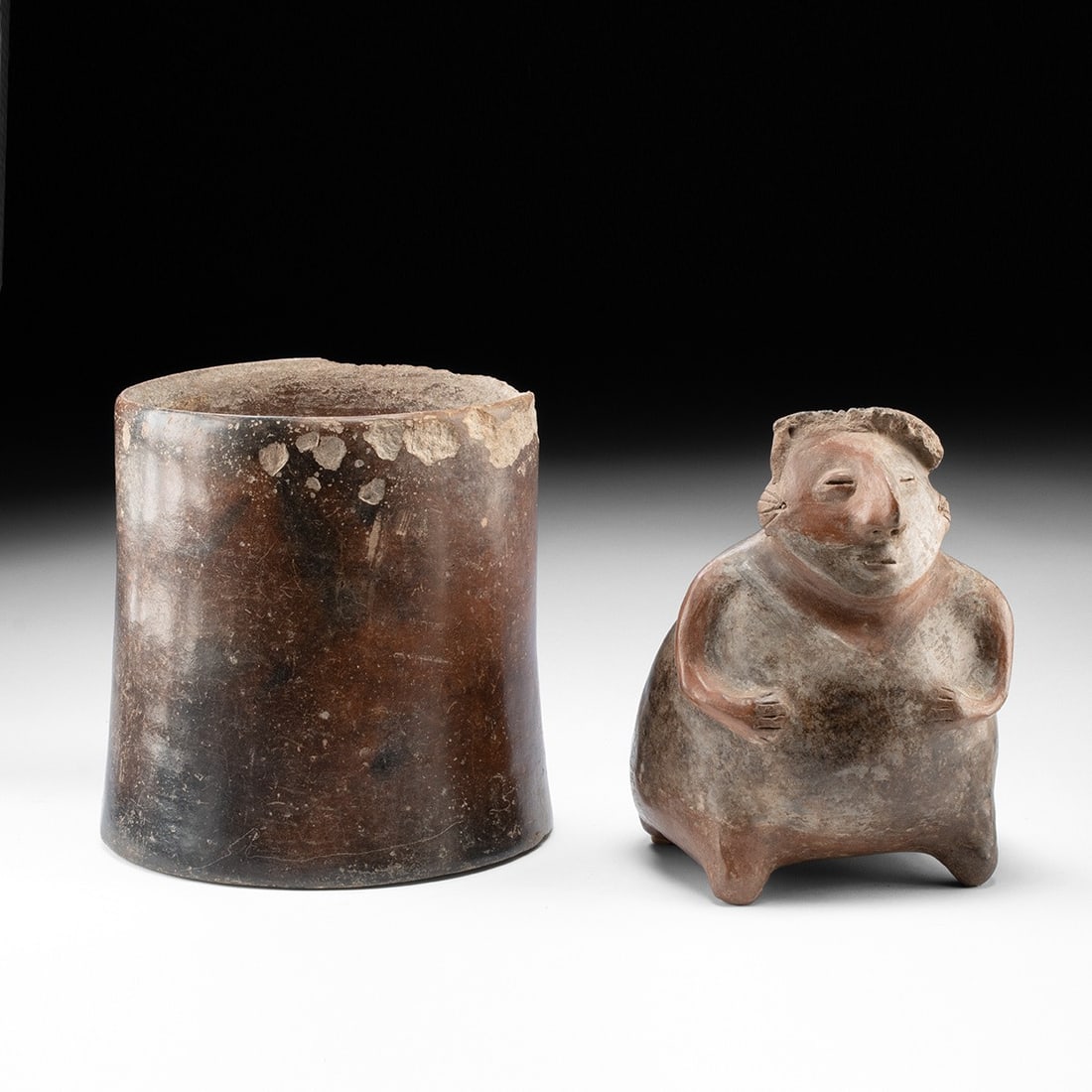 West Mexican Pottery Vessels - Jalisco Figural Effigy & Cylinder Jar: Pre-Columbian, Mexico, Jalisco, ca. 300 BCE – 300 CE. A pair of West Mexican shaft tomb culture pottery pieces. The first is a sizable cylindrical vessel with a highly burnished red-brown exteri