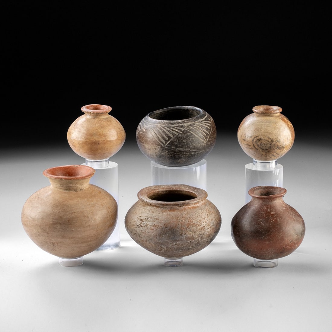 Six Pre-Columbian Pottery Vessels: Pre-Columbian, Mexico & Costa Rica, ca. 300 BCE – 1500 CE. A group of six Pre-Columbian pottery vessels of globular and squat rounded forms, likely from Mexico and Central America. The group inc