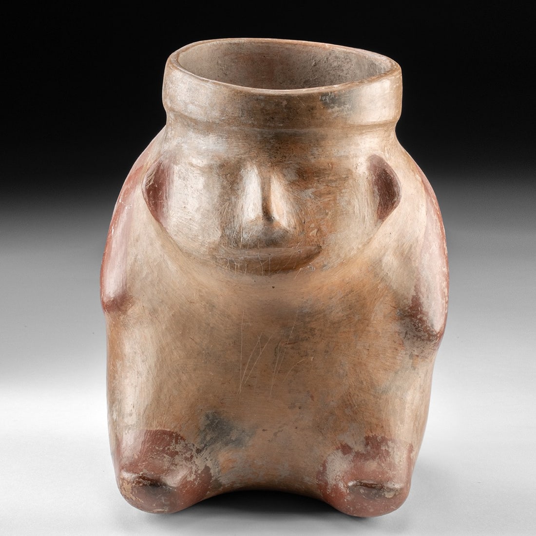Veracruz El Faisan Bichrome Human Effigy Vessel - Seated Figure: Pre-Columbian, Mexico, Veracruz, ca. 300–900 CE. A rounded ceramic vessel modeled as a seated human body, its wide flaring neck rising like an open collar where the head would be. The burnished 