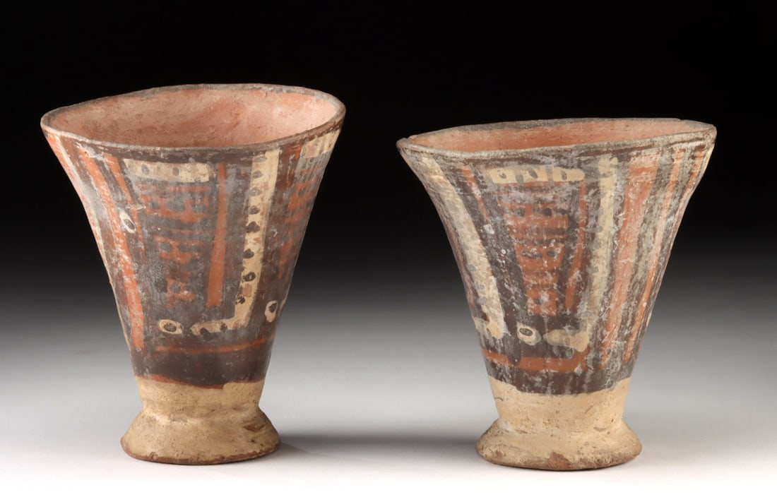2 Huari Humaya Style Polychrome Pottery Cups, TL Tested: Pre-Columbian, Central Coast Peru, Huari (Wari) culture, ca. 600 to 900 CE. A pair of hand-built Humaya style pottery cups, each formed with a broad flaring body rising from a small ring base. Both ar
