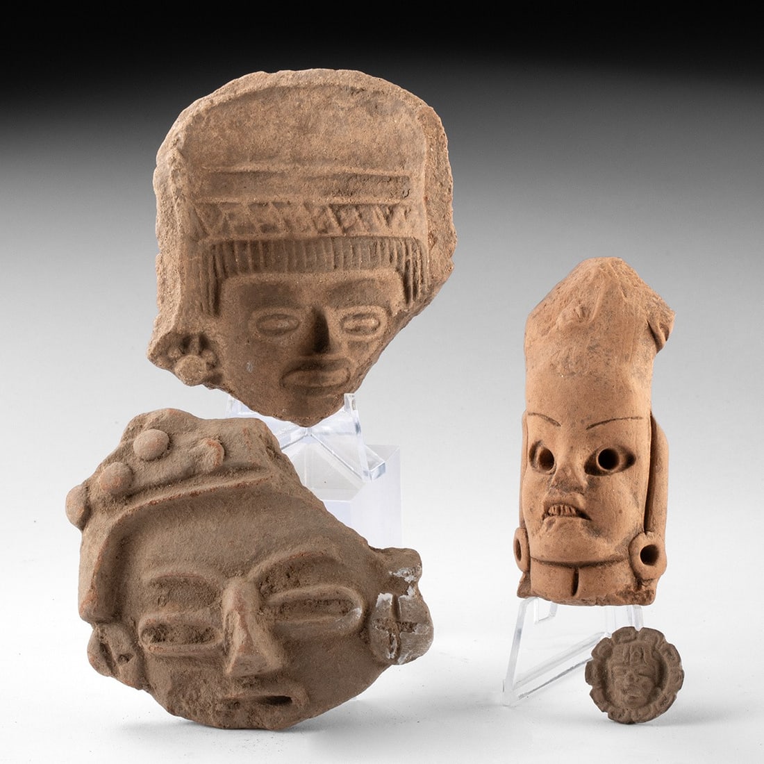 Pre-Columbian Terracotta Face Group - Heads, Mold & Applique: Pre-Columbian, Mexico, Veracruz & San Jeronimo, ca. 300–900 CE. A group of four Pre-Columbian pottery fragments from Mesoamerica, likely Veracruz and San Jeronimo. The group includes two heads f