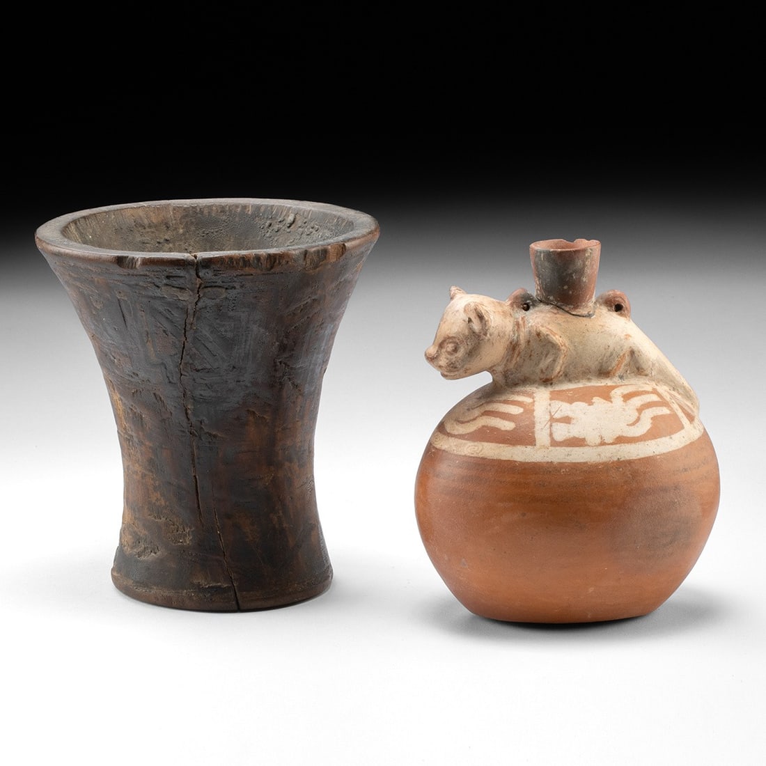 Inca Wood Kero Cup & Jaguar Pottery Vessel: Pre-Columbian, Peru, Inca and Chimu, ca. 1100–1532 CE. A wood drinking kero cup and a pottery jaguar vessel from the Inca Empire of Peru. The first is a carved wood kero, a ceremonial drinking c