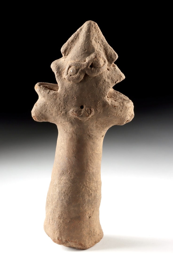 15th C. Ghana Koma Culture Janus-Headed Pottery Finial: West Africa, Ghana, Koma culture, ca. 15th to 16th century CE. A highly stylized terracotta janus-headed finial rising from a thick cylindrical shaft, the opposing faces rendered with applied eyes and