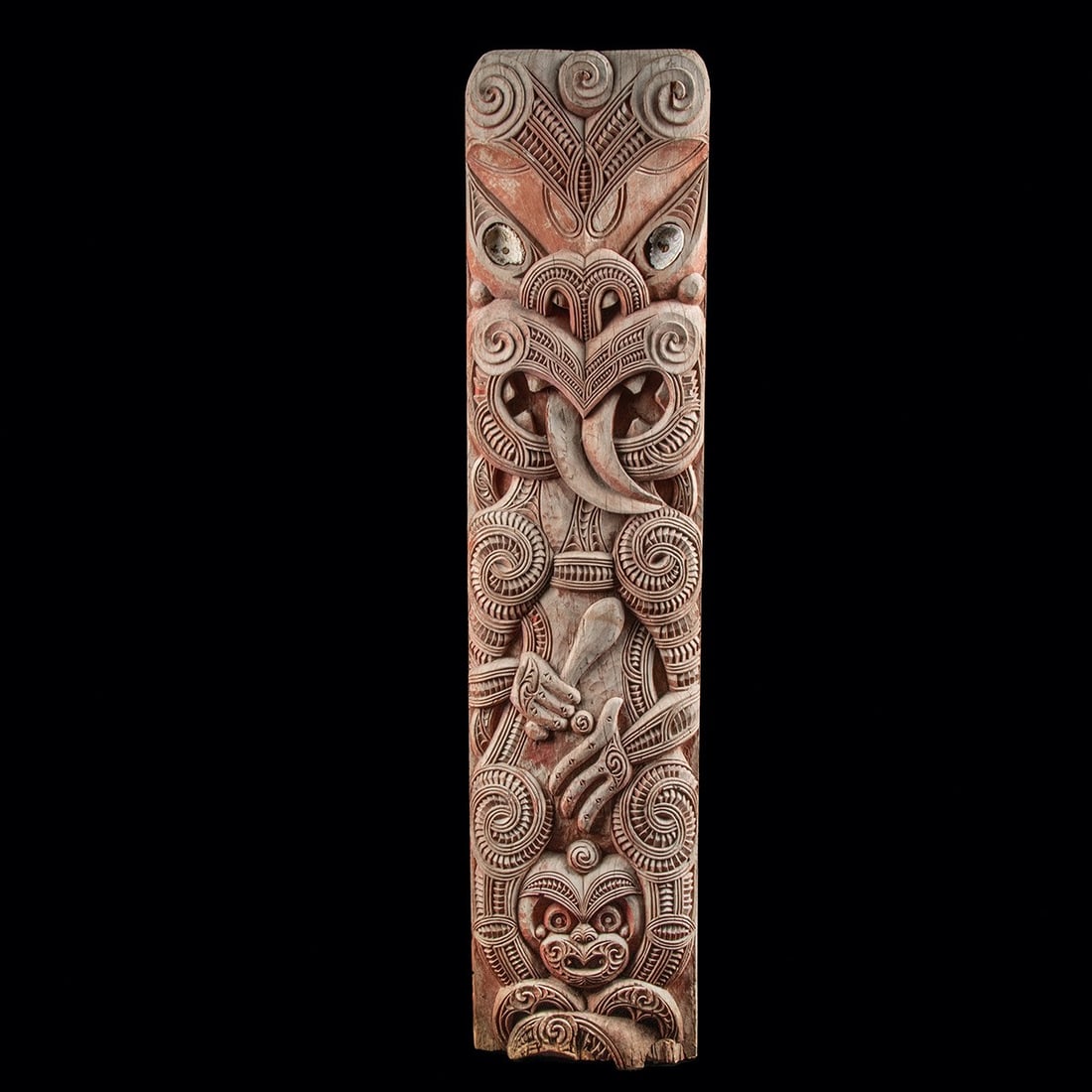 Maori Wood Poupou Panel for Wharenui Meeting House, Carved Tiki Ancestor Figures: Oceania, New Zealand, Maori, ca. early 20th century CE. A carved wooden poupou, the wall panel set along the interior walls of a Maori meeting house (wharenui), where such panels represent ancestors o