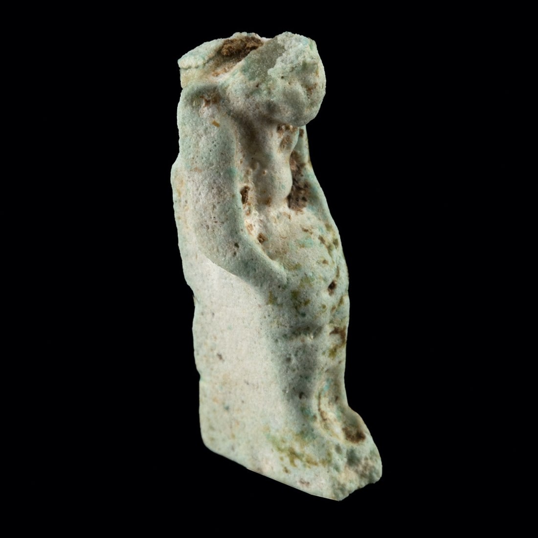 Egyptian Faience Amulet - Possibly Seated Harpocrates: North Africa, Egypt, Late Period to Ptolemaic, ca. 664–30 BCE. A diminutive amulet of pale glazed faience, its form worn to a soft, almost dissolved silhouette. The figure sits or squats compact