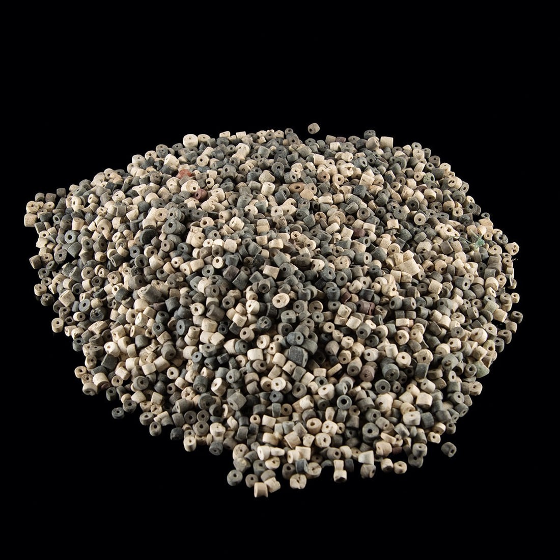 Ancient Sumerian Stone & Shell Beads - One Pound of Disc Beads for Jewelry Making: Near East, Mesopotamia, Sumerian, ca. 3000–2000 BCE. A full pound of ancient beads in small disc and short tube forms, each drilled through the center for stringing. The palette ranges from bone