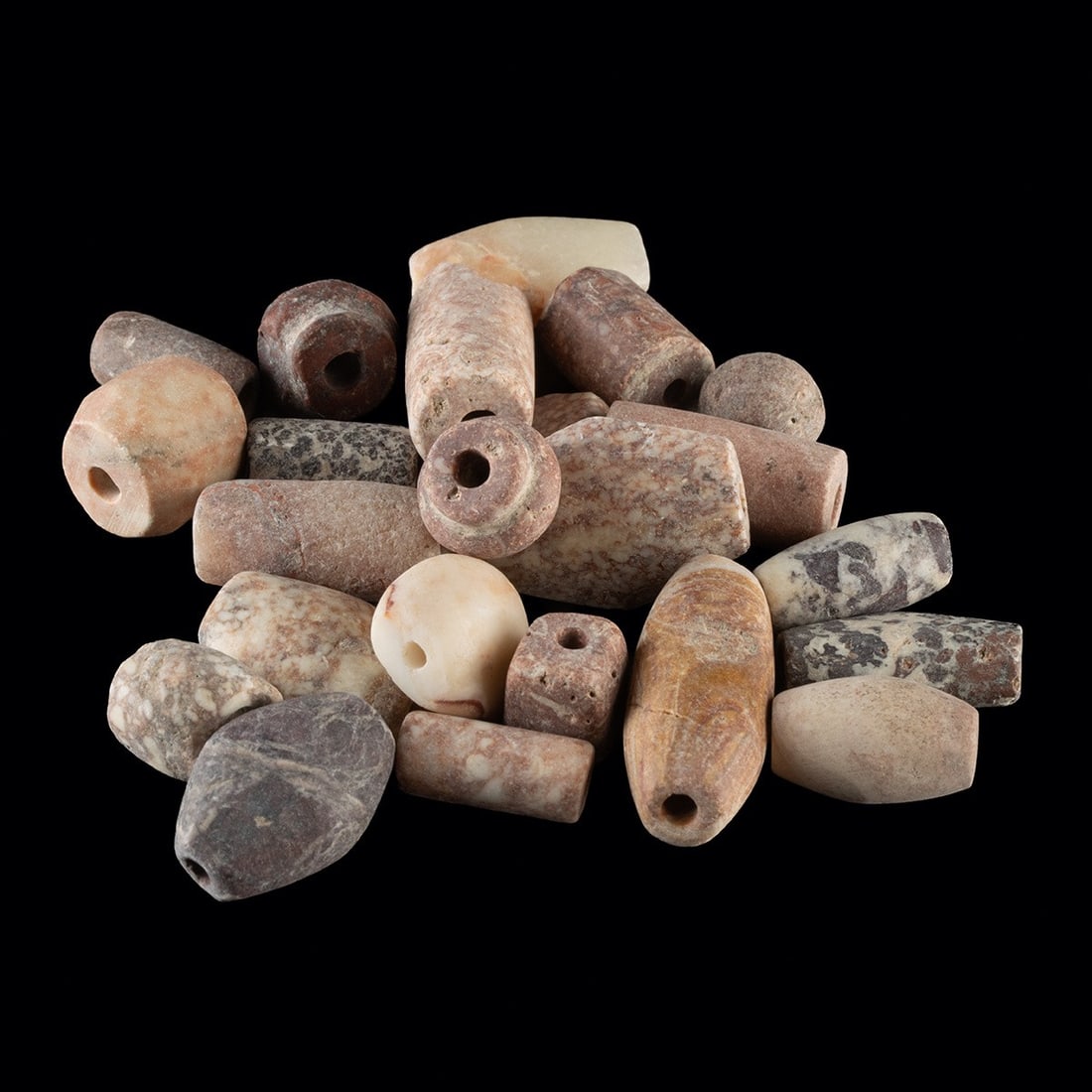 Ancient Near Eastern Stone Bead Collection - Quartzite & Breccia: Near East, Anatolia & North Africa, ca. 1000 BCE – 500 CE. A group of ancient stone beads, likely from the Near East, Anatolia, Egypt, and North Africa. The beads are worked from quartzite and m