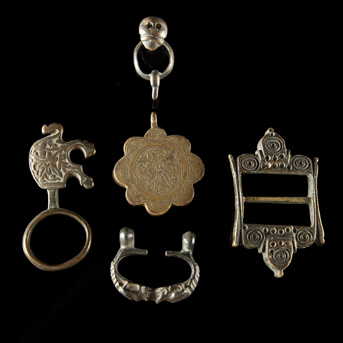 19th C. Central Asia Bronze & Brass Dress Fittings, Lot of 5 - Buckle, Pendant, Clasps: Central Asia and Near East, Ottoman and Persian traditions, ca. 18th to early 20th century CE. A collection of five bronze and brass items from Central Asia, Ottoman and Persian cultures. The group in