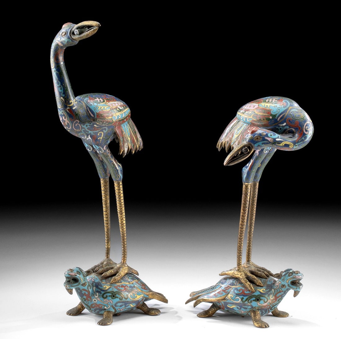 Chinese Cloisonne Cranes (Atop Dragon Turtles): East Asia, China, Qing Dynasty, ca. late 19th to early 20th century CE. A beautiful pair of leaded-brass and cloisonne enamel cranes mounted upon a pair of dragon turtles ('longgui' in Chinese). The c