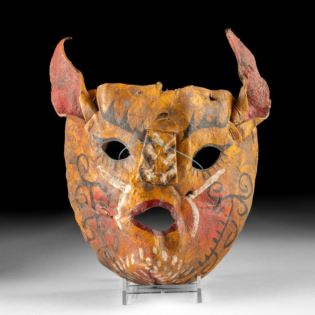Rare Mexican Leather Tigre Dance Mask - Painted Jaguar: Mexico, ca. early to mid 20th century CE. A molded leather tigre festival mask, hand painted and sculpted, with an yellow ground, upswept red ears, arched black brows, whisker marks, scrolling designs