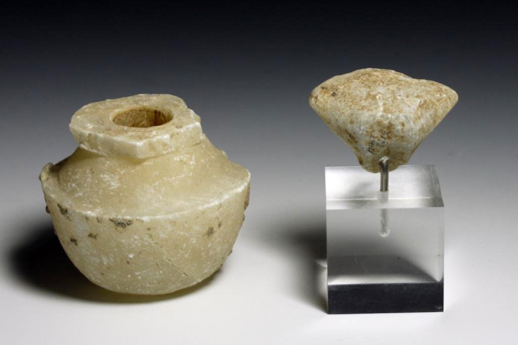 (2) Anatolian Alabaster Carvings - Stargazer and Pyxis: Starts at $75 Anatolia, ca. 2nd Millennium BCE. First a Bactrian pyxis with carved rim and shoulder. The second, a stargazer head with two flat sides forming a triangular shape. 3-1/2"H & 1-1/2"H resp