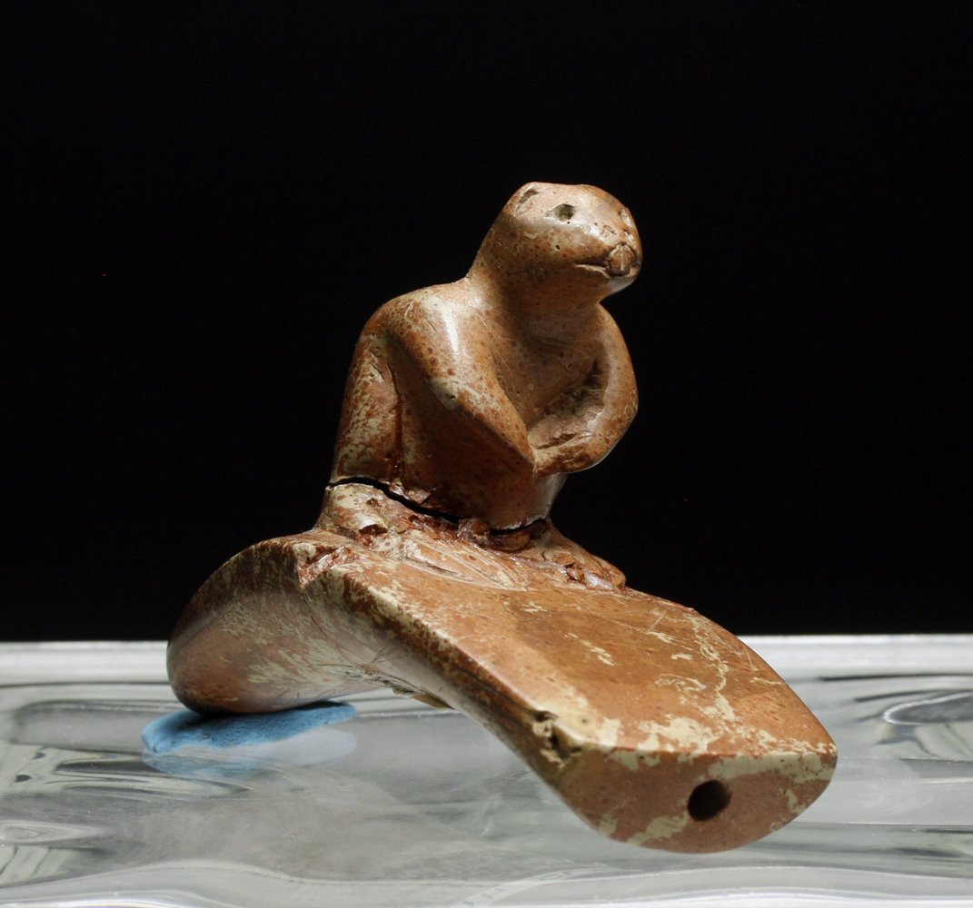 Native American Hopewell Period Pipe - Beaver: Ashland County, Ohio, Ca 500 to 100 BCE. Interesting carved red steatite stone pipe in crescent form with small beaver sitting atop, bowl behind his back. Stickered on base with "Ashland, County, Ohio