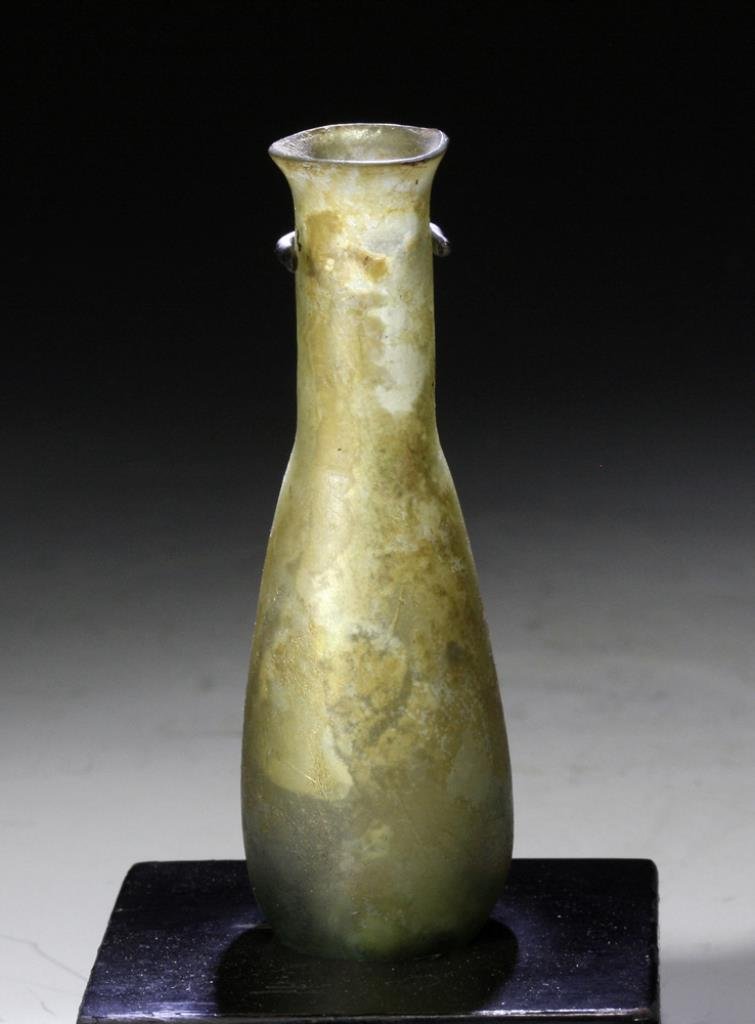 Roman Glass Tear Vial: Starts at $50 Roman Empire, most likely Asia Minor, Ca 200 to 300 CE. Lovely nearly-clear glass vial in very thin "fabric" with lovely golden iridescence. 3-3/4"H. PROVENANCE: Ex-Private Canadian col