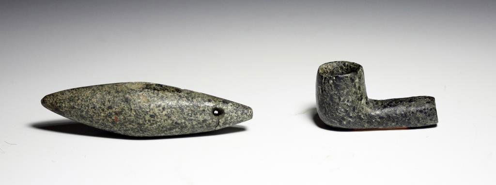 Mississippian Stone Pipe + Fish Weight: Starts at $100 Tennessee, Ca 500 to 1200 CE. Pair of early North American stone artifacts. First is a black speckled stone pipe in elbow form and simple design. Next is a long thin speckled stone fish
