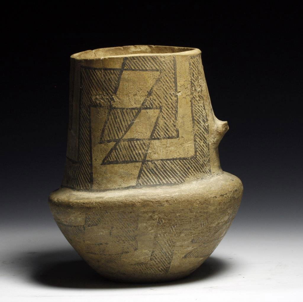 Chaco Anasazi Black-on-White Pitcher: Starts at $250 Pre-Historic, Chaco Canyon, NM, Ca 1075 to 1150 CE. Fine pottery jug in tan slip with geometric pattern filled with diagonal lines. 6-1/2"H. PROVENANCE: Ex-Vickery collection, acquired