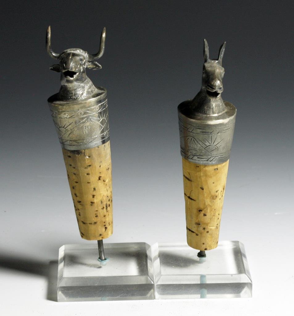 (2) Vintage Peruvian Silver Wine Pourers / Stoppers: Starts at $150 Peru, ca. 1930 A charming pair of 925 silver wine pourers/stoppers depicting a bull and a llama. Each stopper is set on cork and mounted on stands. The bodies are beautifully detailed a