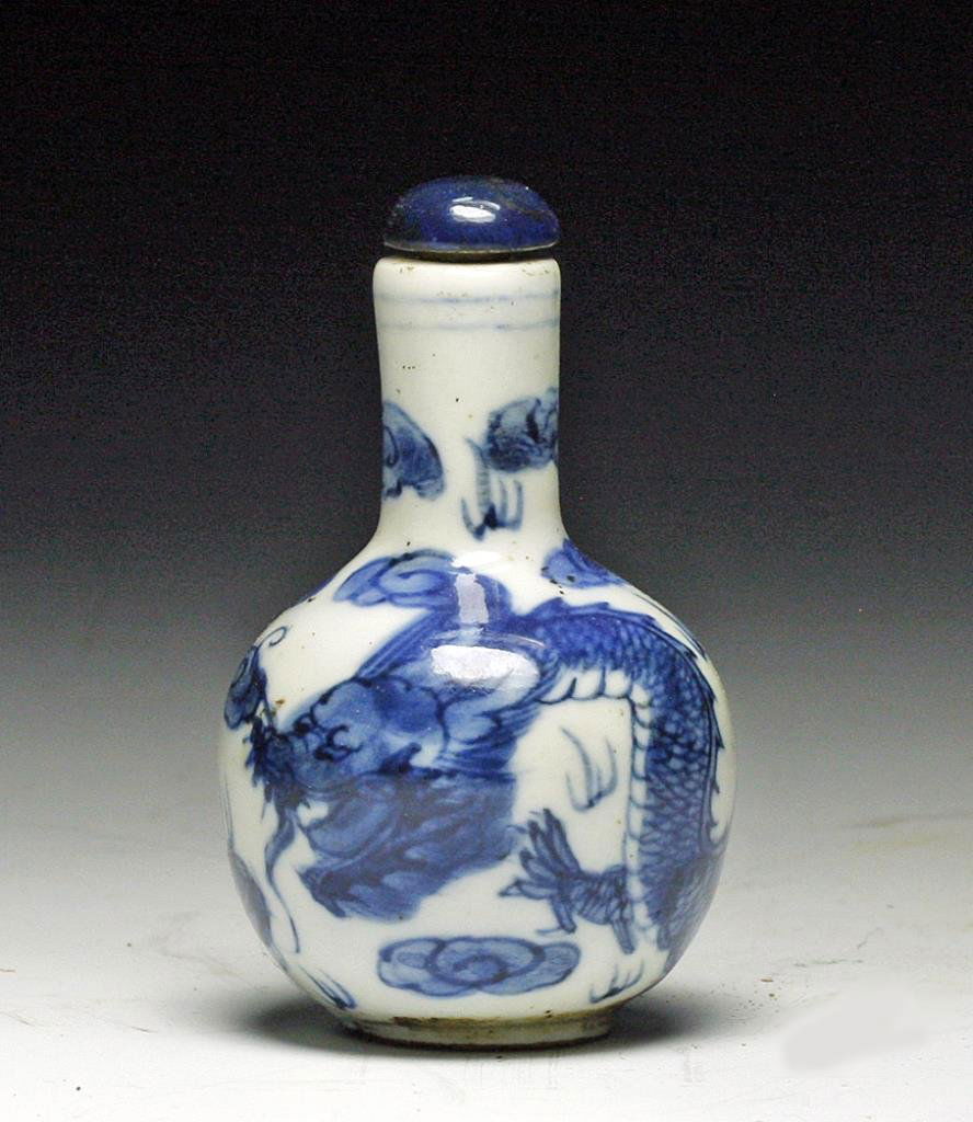 Antique Chinese Garlic Form Porcelain Snuff Bottle: Starts at $50 China, late 19th-early 20th Century. Fine and early example! Porcelain snuff bottle in blue on white, bottle in garlic bulb form, decorated with long sinister dragon, chop mark on base.