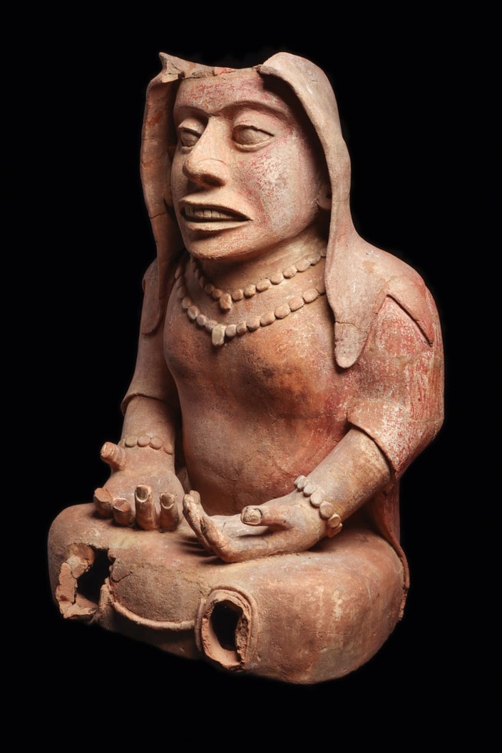 Remojadas Large Seated Female "Goddess" Figure, Veracruz: Pre-Columbian, Mexico, Veracruz, Remojadas, ca. 600–1100 CE. A monumental salmon-toned ceramic woman sits cross-legged, hands resting open on her lap, fingernails crisply modeled. She wears a ho