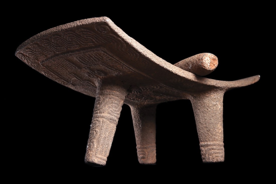 Atlantic Watershed Carved Volcanic Stone Metate with Mano, Costa Rica: Pre-Columbian, Costa Rica, Atlantic Watershed, ca. 800–1000 CE. A large rectangular grinding table of gray volcanic stone, its gently concave plate raised on three tapering integral legs. The un