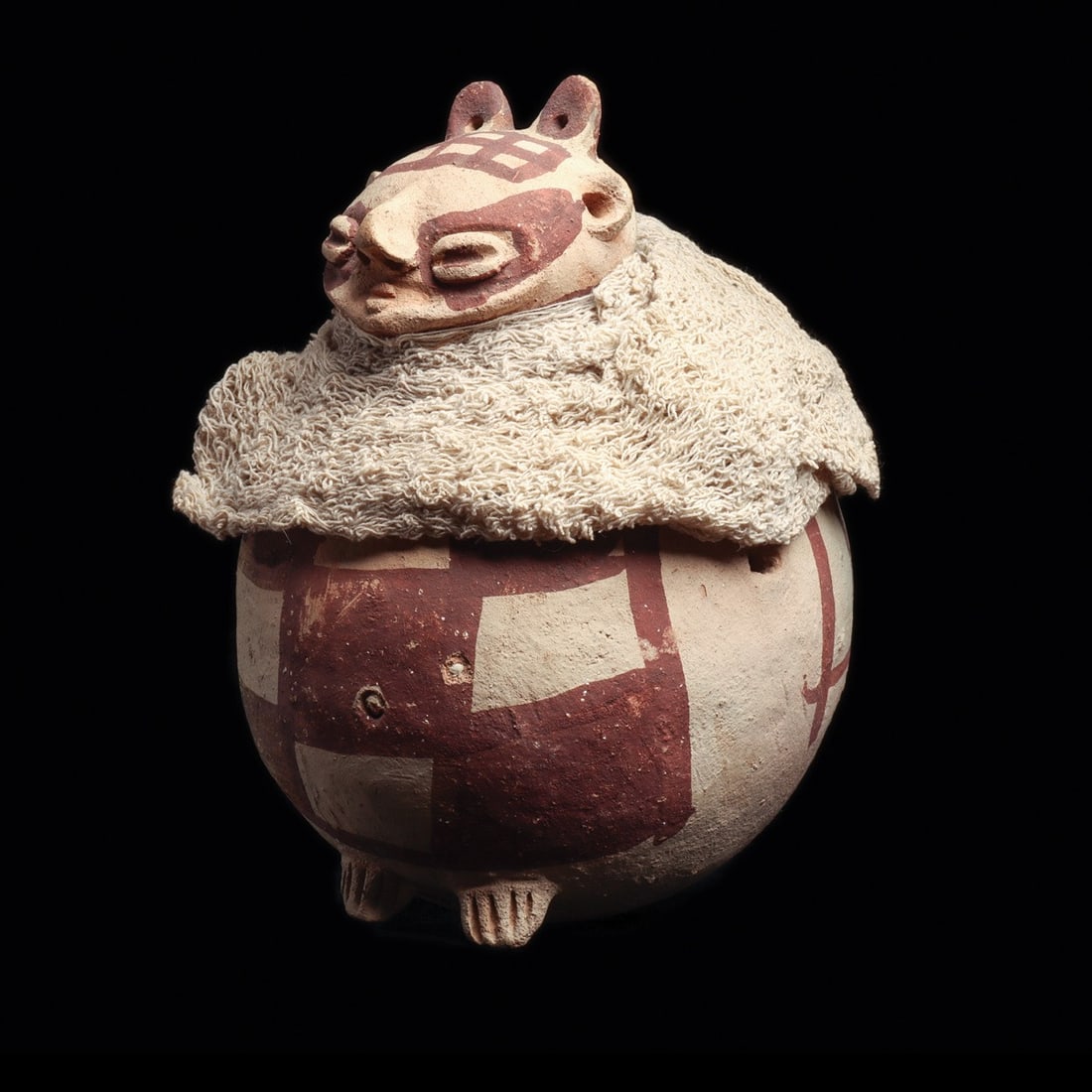 Chancay Rotund Figural Vessel with Gauze Textile Wrap: Pre-Columbian, Peru, Chancay, ca. 1000–1250 CE. A globular pottery vessel modeled as a corpulent seated personage, his body the swelling belly of the jar and his tiny splayed feet pressed agains
