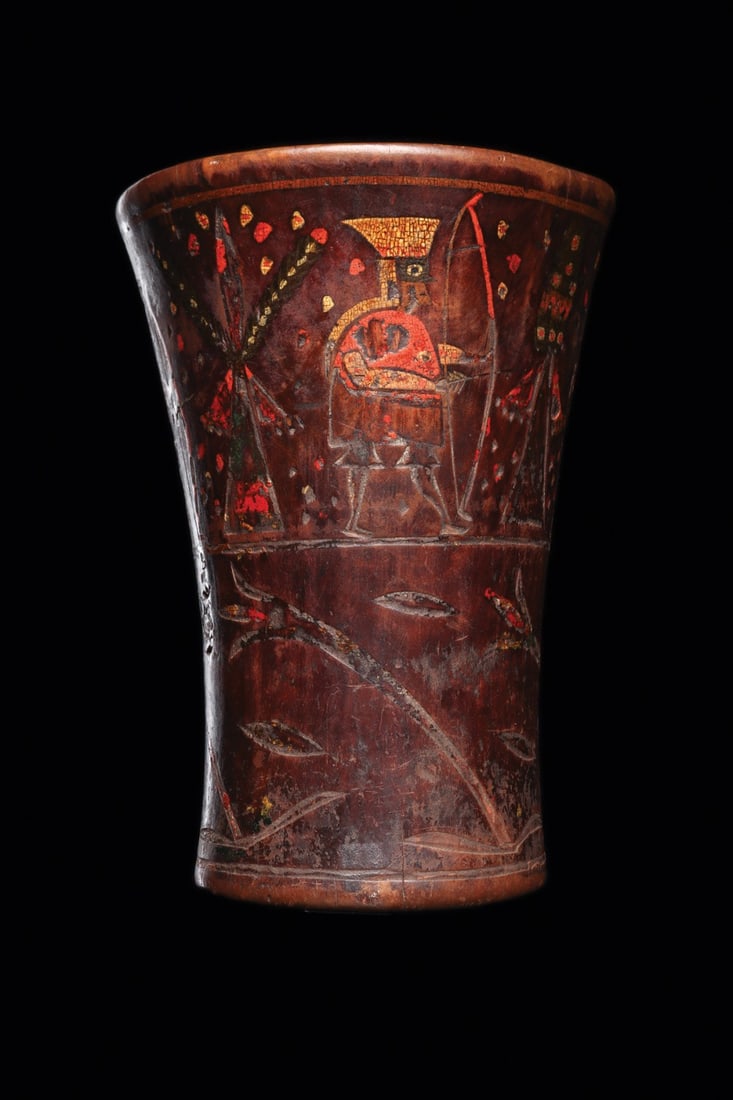 Inca Kero Cup with Royal Archers Drawing Bows, Painted Wood: Pre-Columbian, Peru, Inca, ca. 1400–1521 CE. A generously scaled hardwood kero of flaring corset form, its walls incised and filled with multicolored mineral pigments in red, ochre, gold and dee