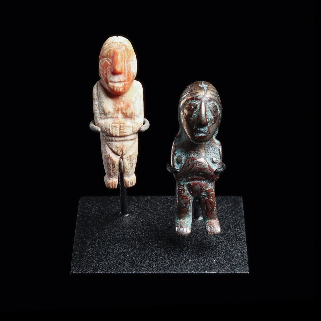 Inca Miniature Female Figures, Silver & Spondylus Shell, Pair: Pre-Columbian, Peru, Inca, ca. 1400–1521 CE. A pair of miniature female effigies, one cast in solid silver, the other carved from warm orange and cream spondylus shell. Both stand frontally with