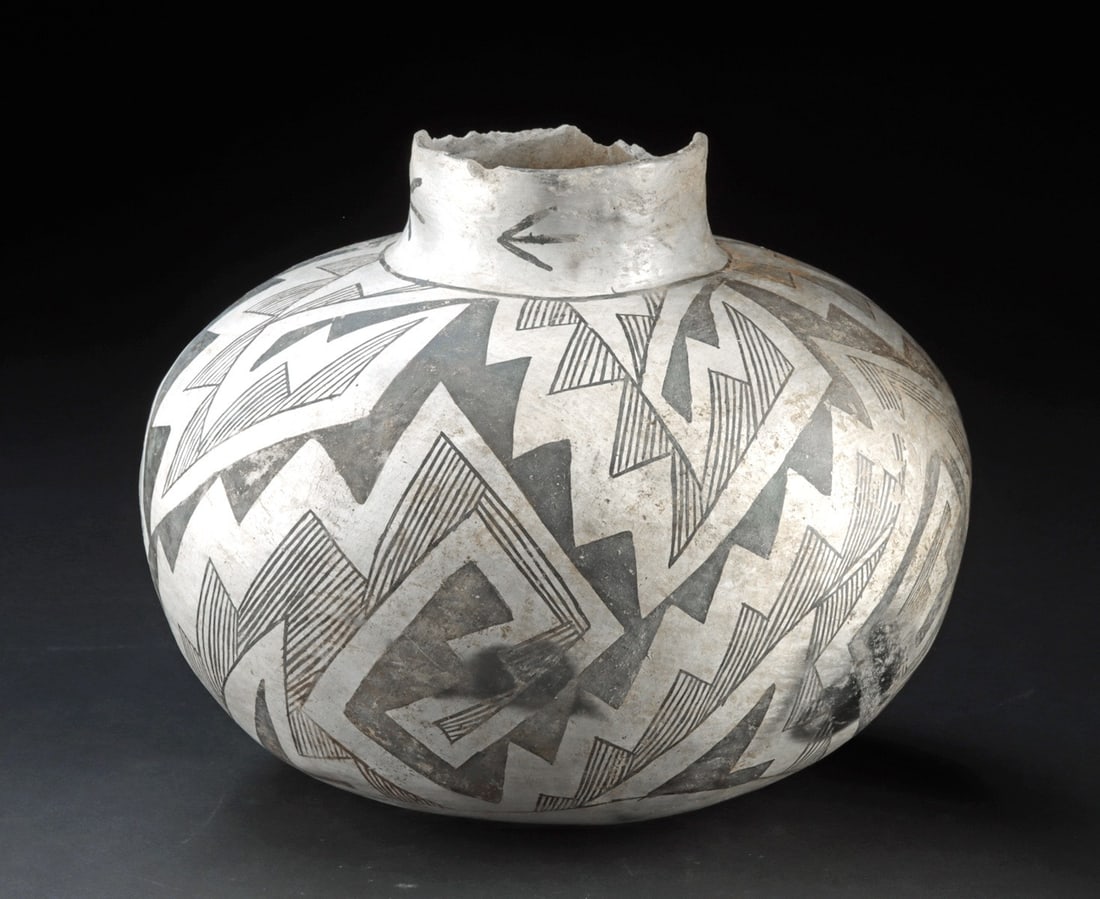 Ancestral Puebloan Black-on-White Pottery Jar - Tularosa: Anasazi, ca. 1100–1300 CE. Ancestral Puebloan (Anasazi), Cibola White Ware, American Southwest, ca. AD 1150–1300. A broad-shouldered storage olla of compressed globular form, the body swel