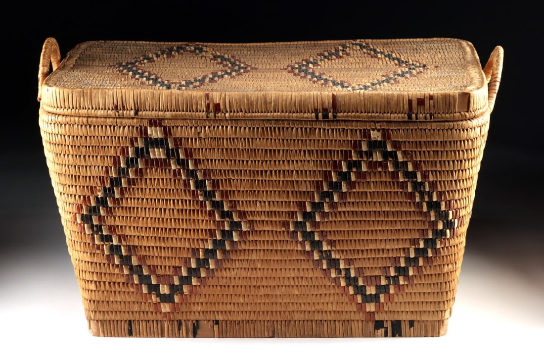 Salish Coiled Cedar Root Storage Basket, Imbricated Design: Native American, Northwestern United States / Canada, Salish, ca. mid-20th century CE. A rectangular coiled storage basket built from cedar root, with walls rising in tight, even slats to a flat fitte
