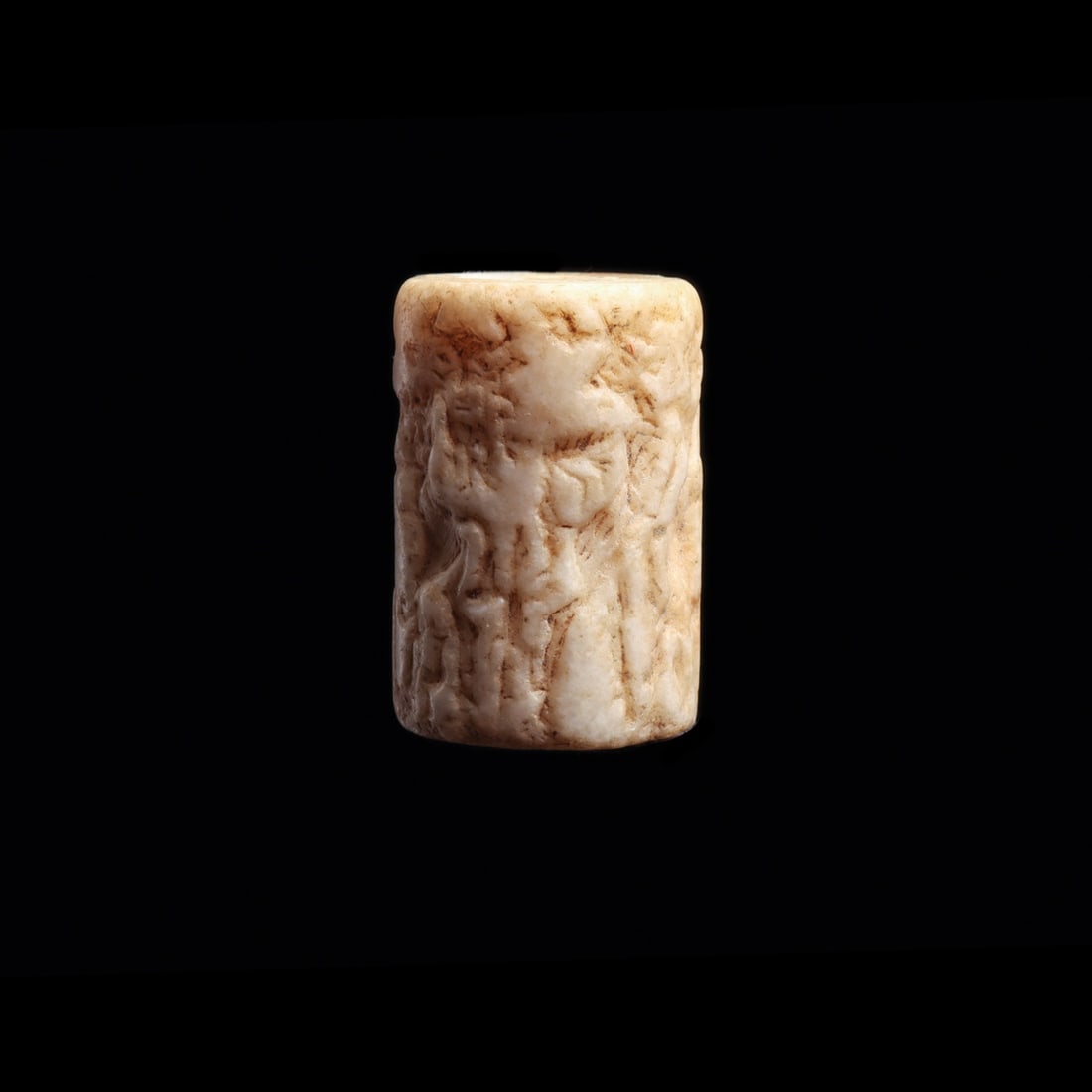 Akkadian Cylinder Seal with Contest Scene of Heroes and Bull-Men: Near East, Mesopotamia, Akkadian, ca. 2350–2150 BCE. A pale, creamy white stone cylinder, pierced lengthwise and carved in intaglio so that rolling it across damp clay yields a continuous frieze