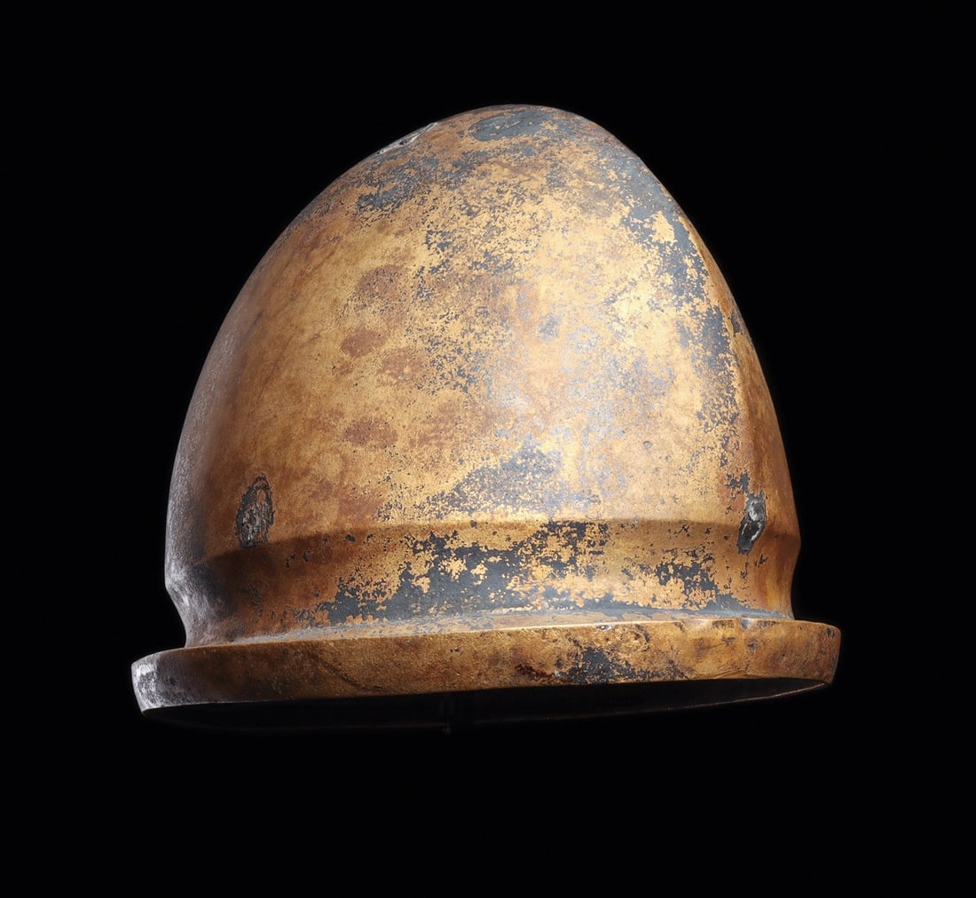 Etruscan Negau Type Helmet with Median Ridge and Flanged Rim: Italy, Etruria, Etrusco-Villanovan, ca. 450–350 BCE. A high domed war helmet raised from hammered sheet, its crown swept up to a median ridge running front to back and finished at the base with 