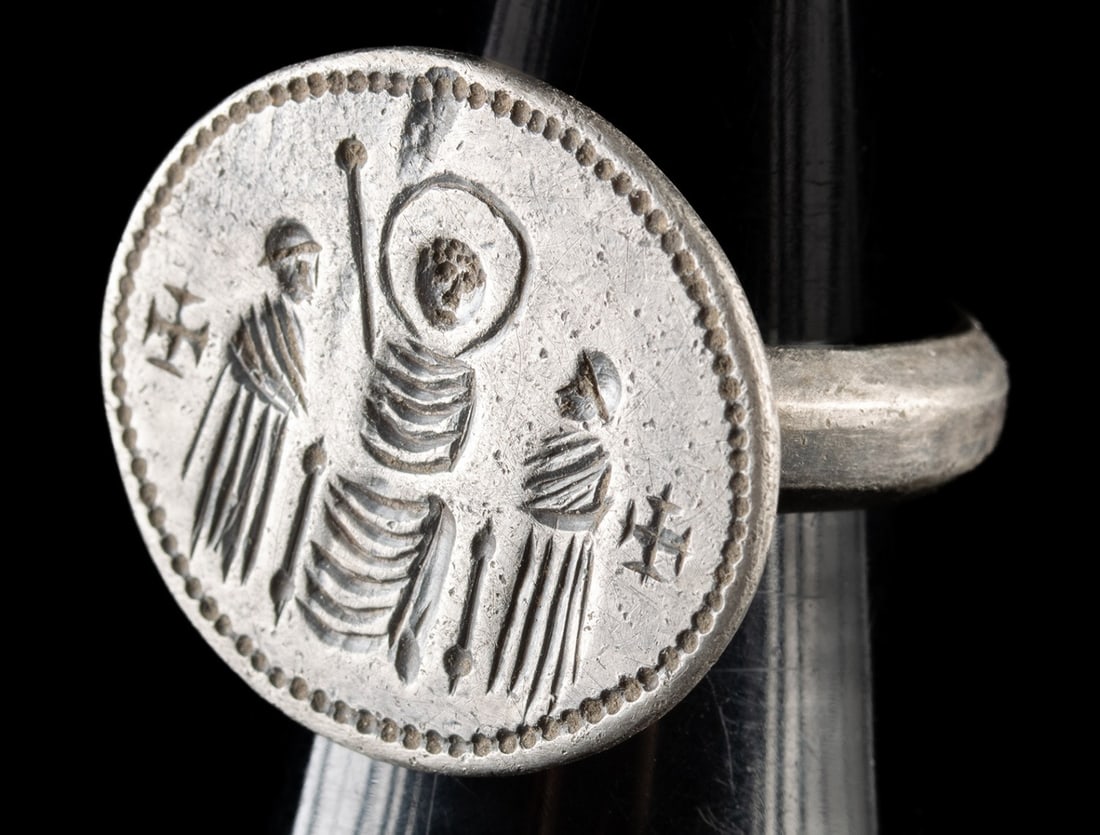 Byzantine Silver Insignia Ring | Christ in Majesty: Ca. 900–1200 CE. Ancient Near East, Byzantine Empire, ca. 10th to 12th century CE. A Byzantine silver insignia ring with a circular bezel incised with three draped figures arranged symmetrically