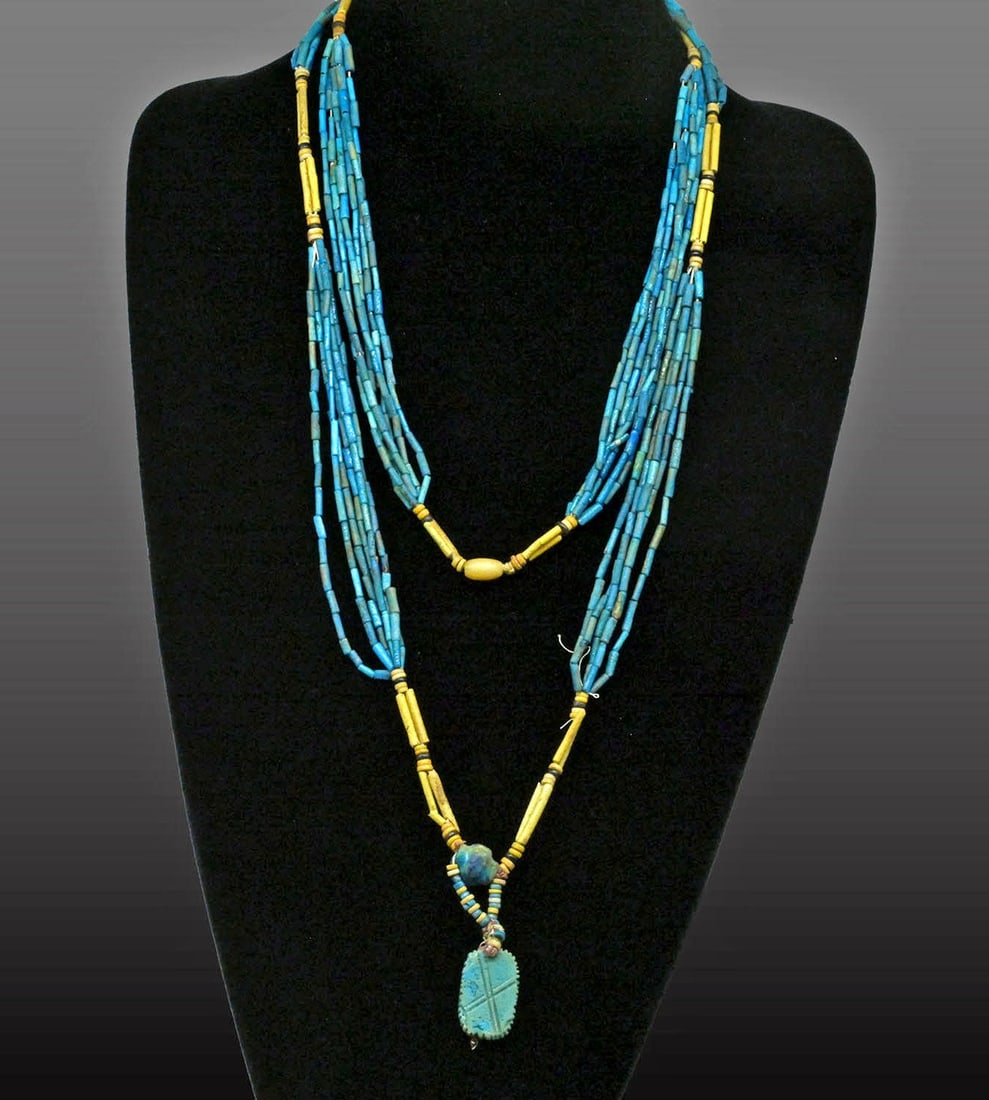 Egyptian Faience Multi-Strand Bead Necklace - Flapper Restringing: Egypt, Late Period, ca. 664–332 BCE. A cascade of turquoise-blue faience tube beads, many strands deep, their glazes ranging from bright copper blue to soft green and grey where burial altered t